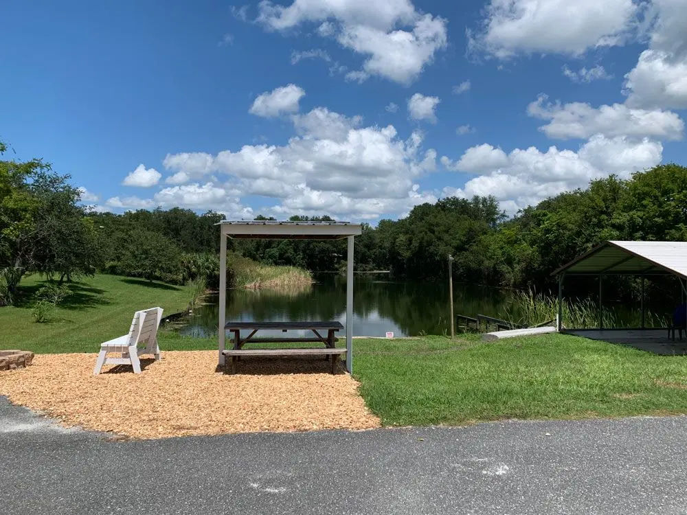 Canal-side picnic spot with a peaceful water view at Sunny Shores
